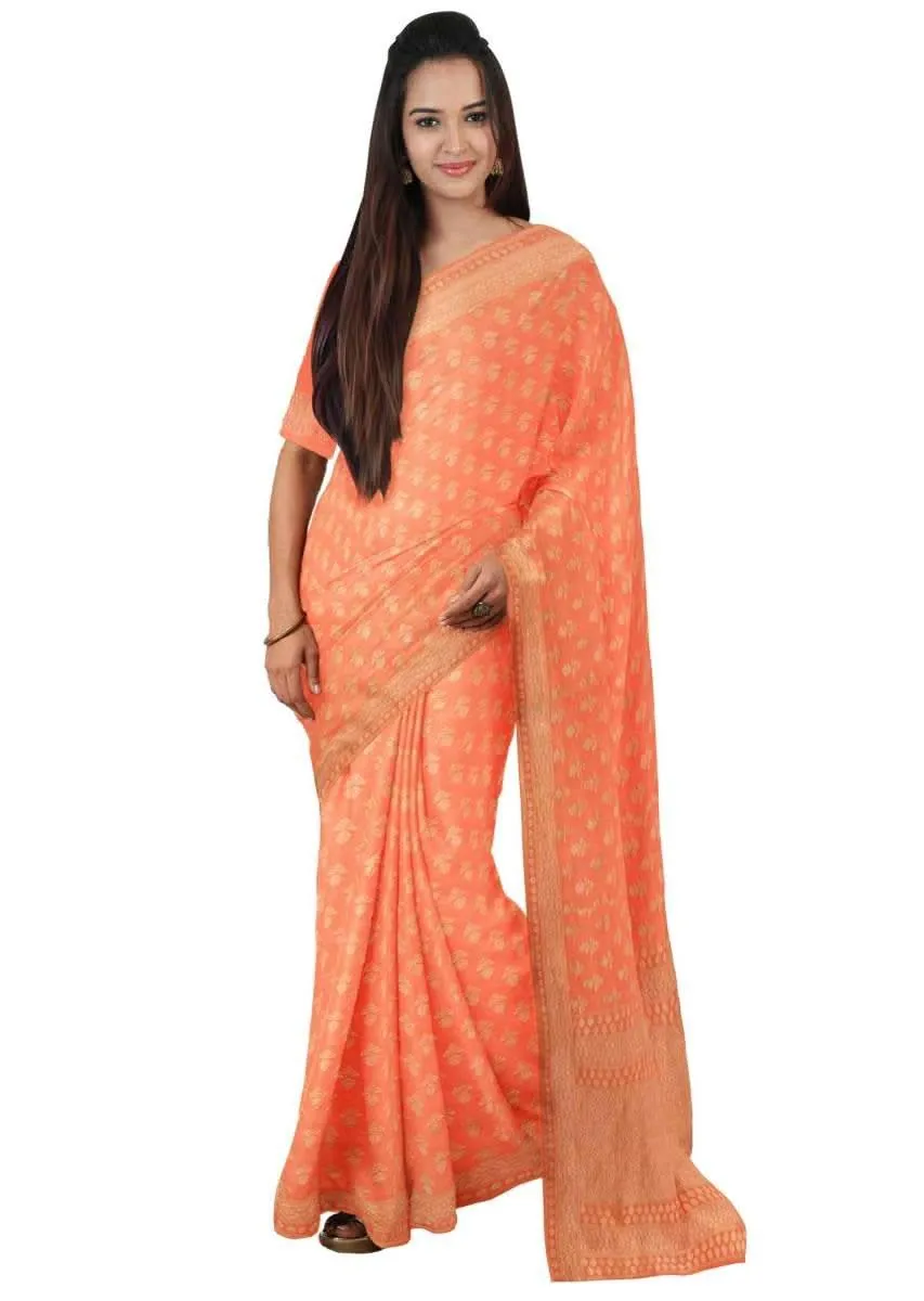 Coral orange georgette saree with weaved pattern only on Kalki