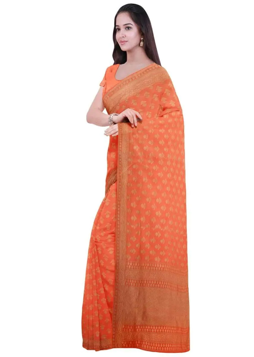 Coral orange georgette saree with weaved pattern only on Kalki
