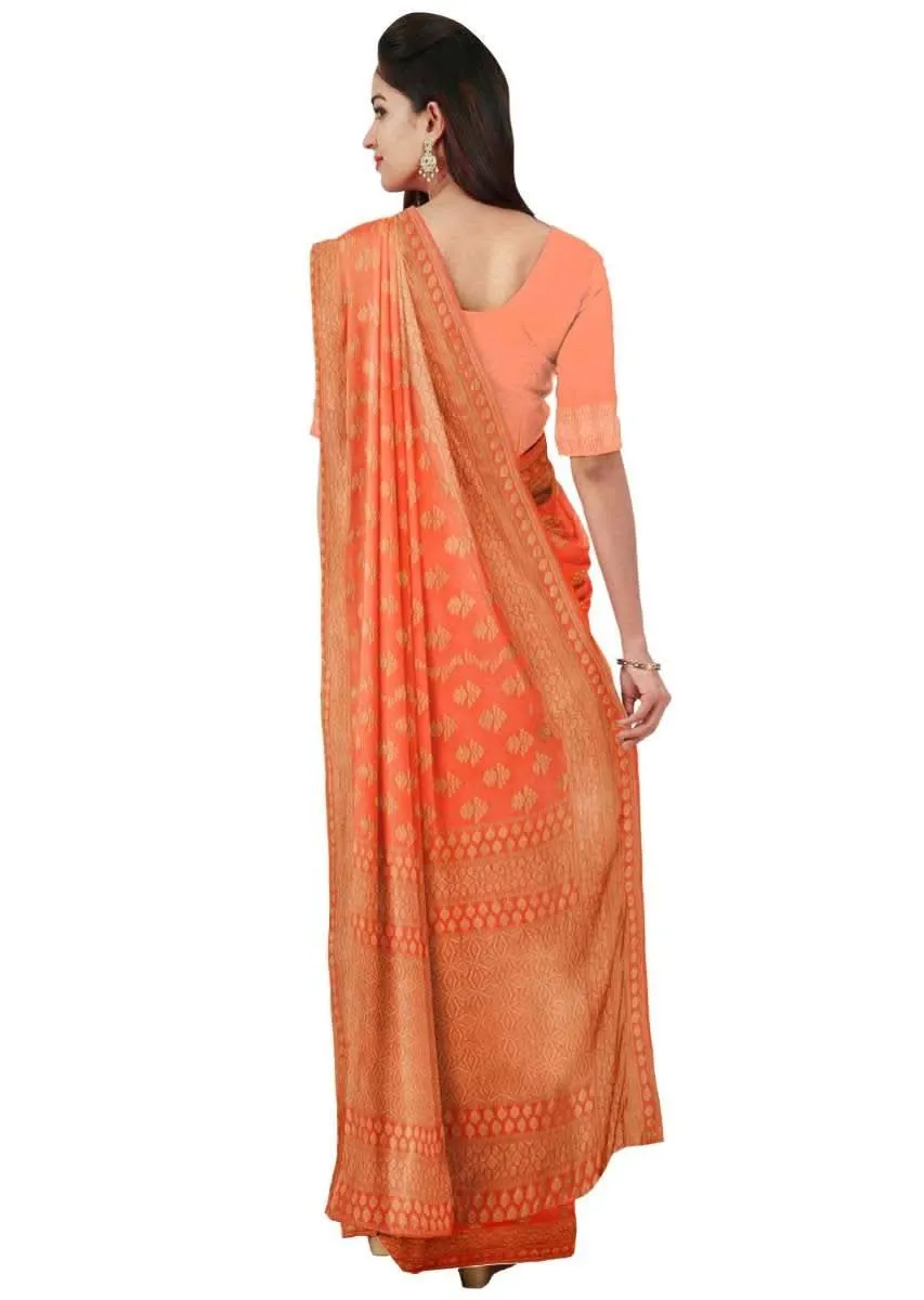 Coral orange georgette saree with weaved pattern only on Kalki