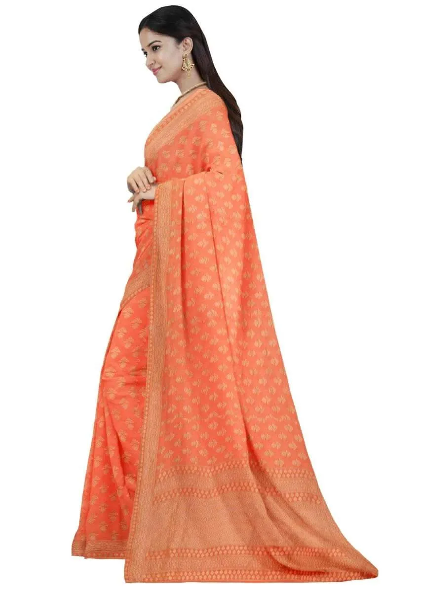 Coral orange georgette saree with weaved pattern only on Kalki